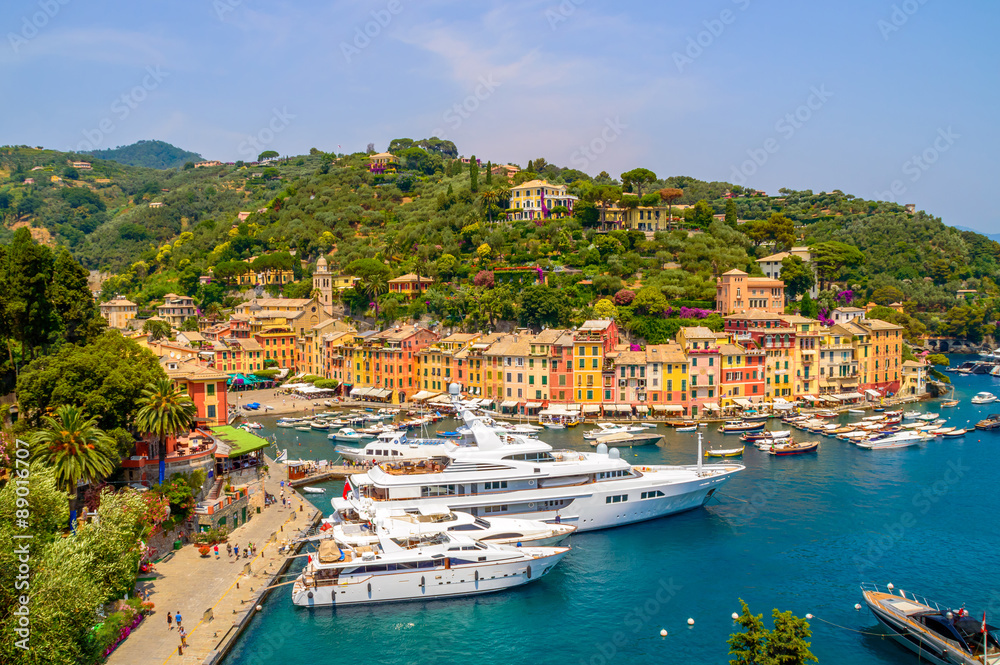 Portofino, Italy and it's port with yachts, on a hot summer day