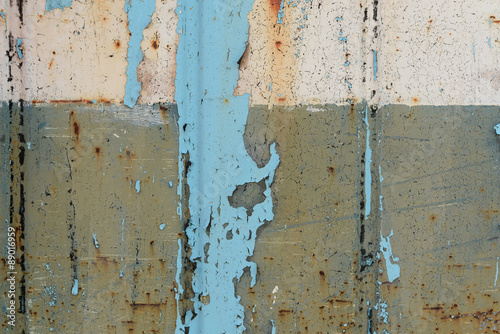 old rusty wall with peeling blue paint