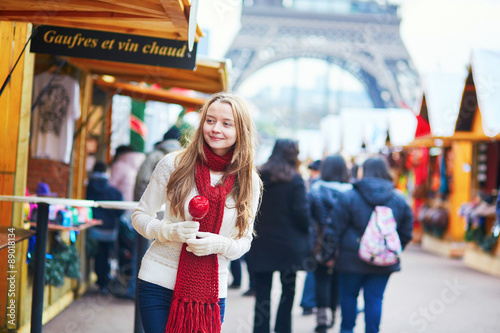 Canvas Print Happy young girl on a Parisian Christmas market