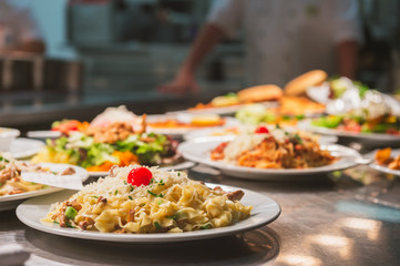 Food orders on the kitchen table in the restaurant