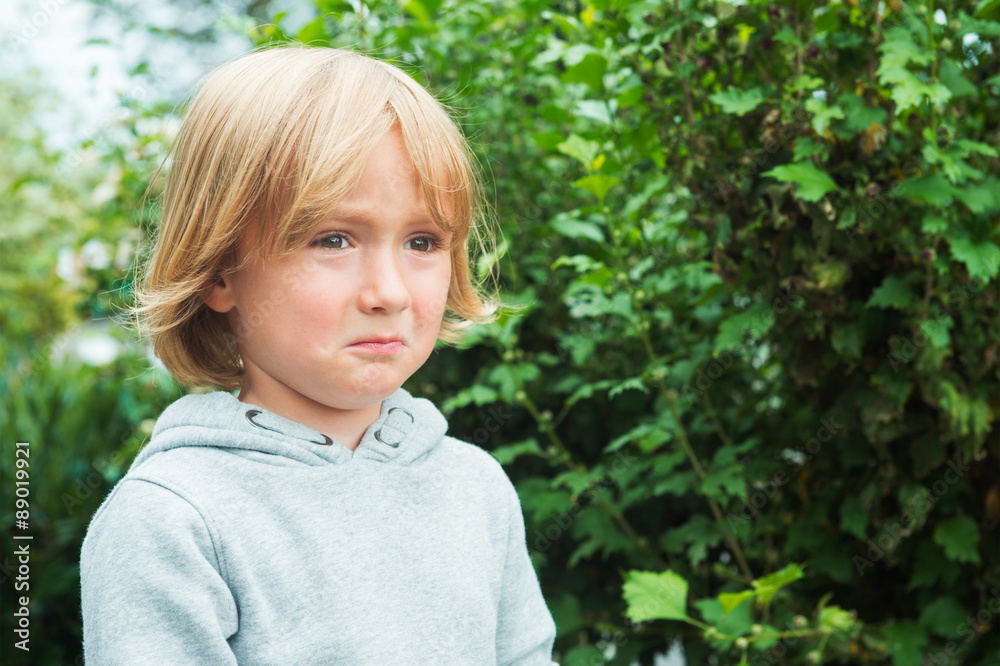 Close up portrait of a sad little boy Close up portrait of a sad little boy