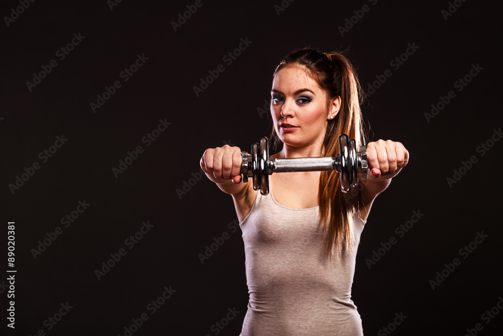 athletic woman working with heavy dumbbells athletic woman working with heavy dumbbells