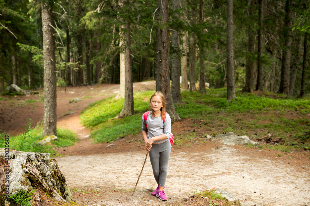 Little hiker girl in forest. Photo from Champex-Lac, Valais, swiss Alps Little hiker girl in forest. Photo from Champex-Lac, Valais, swiss Alps