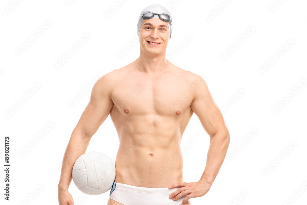 Young male water polo player holding a ball and looking at the c