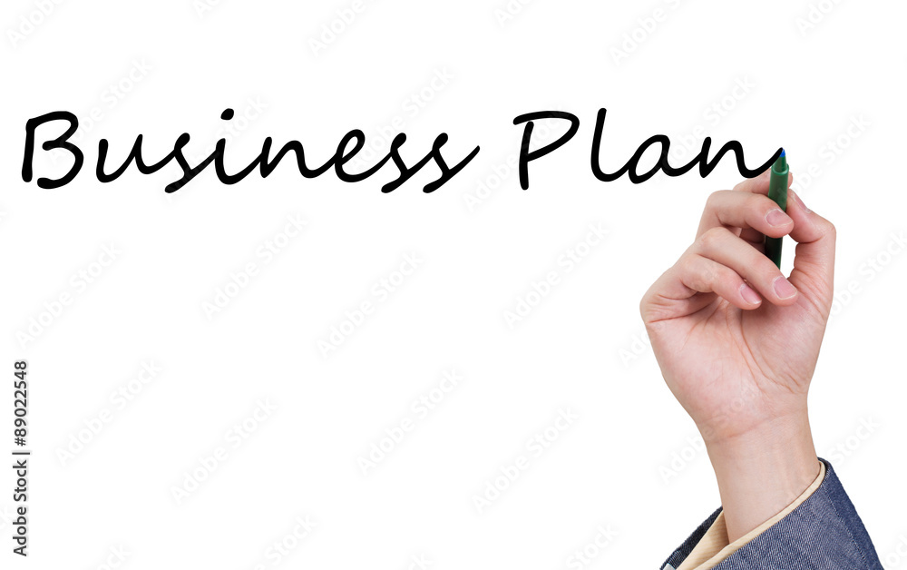 Asian male hand writing business plan on white board Asian male hand writing business plan on white board