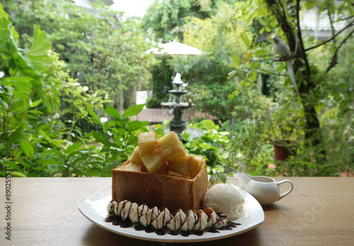 Honey toast bread with ice crame and banana photo