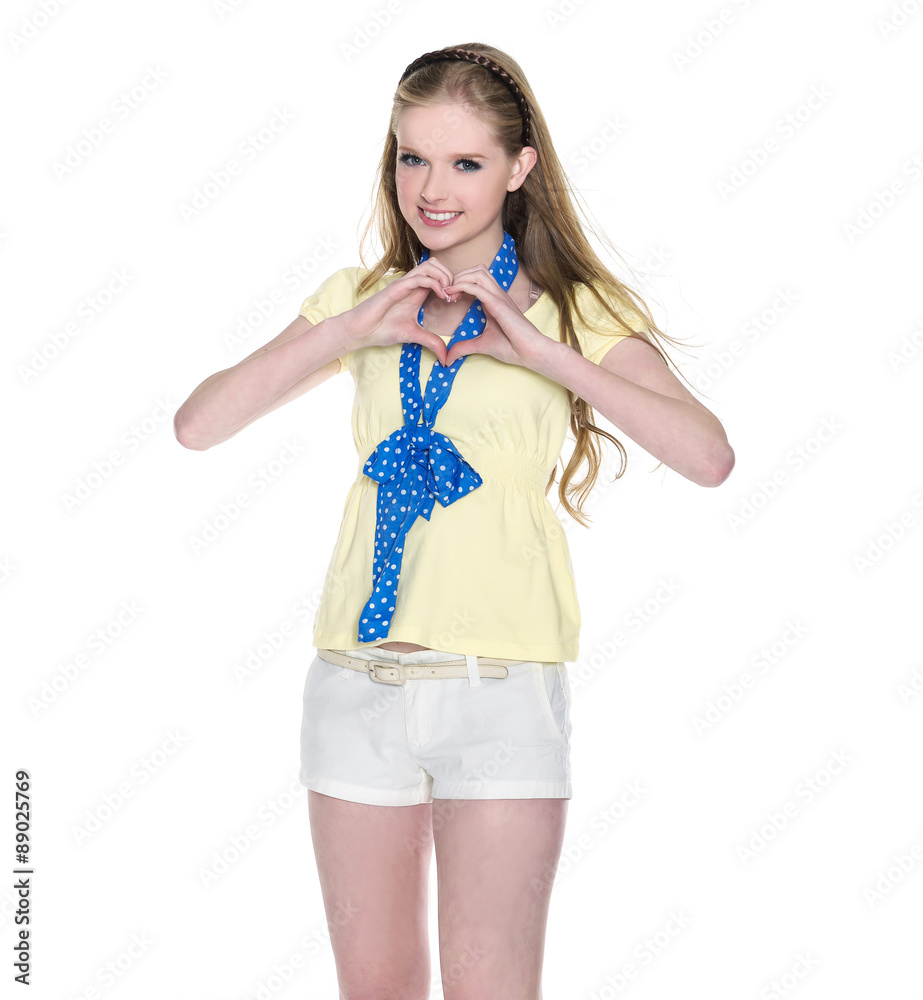 Attractive smiling girl makes the sign of the heart with her fingers. Attractive smiling girl makes the sign of the heart with her fingers.