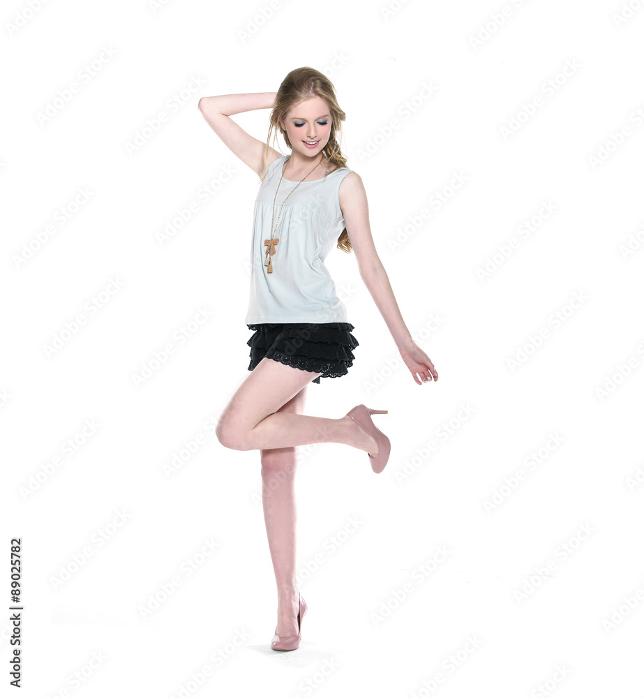 Full body beautiful young woman in trousers, shorts posing Full body beautiful young woman in trousers, shorts posing
