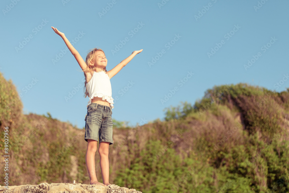 Happy Little girl standing on the beach Happy Little girl standing on the beach