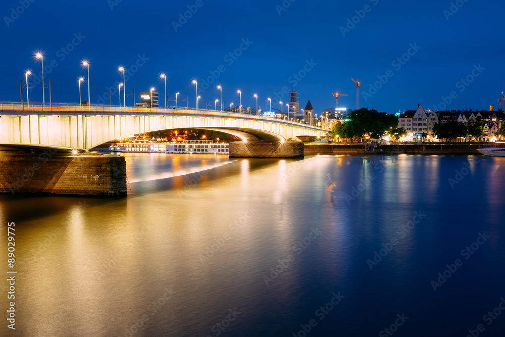 Night View Of Deutz Suspension Bridge Over River Rhine, Germany.