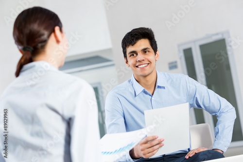 Two young people working as partners