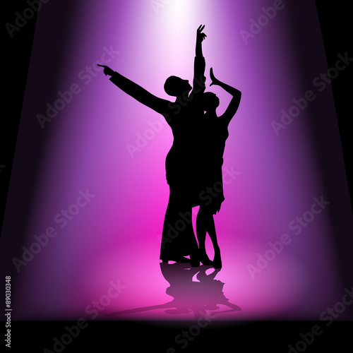 Dancing couple in spotlight