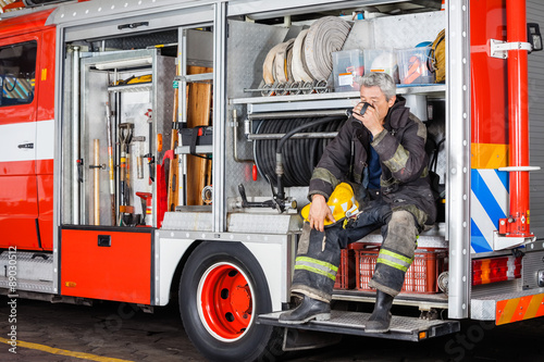 Fireman Drinking Coffee While Sitting In Truck