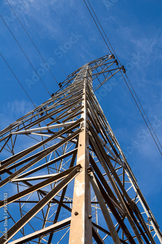 Bild auf Leinwand Electric power transmission with blue sky