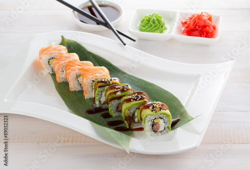 Japan cuisine. Sushi on a gete over wooden background photo