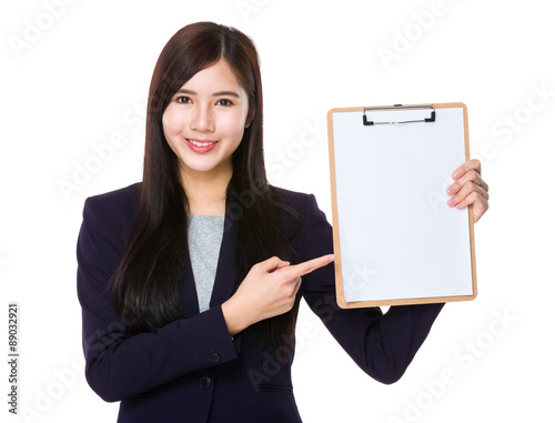 Asian businesswoman finger point to clipboard