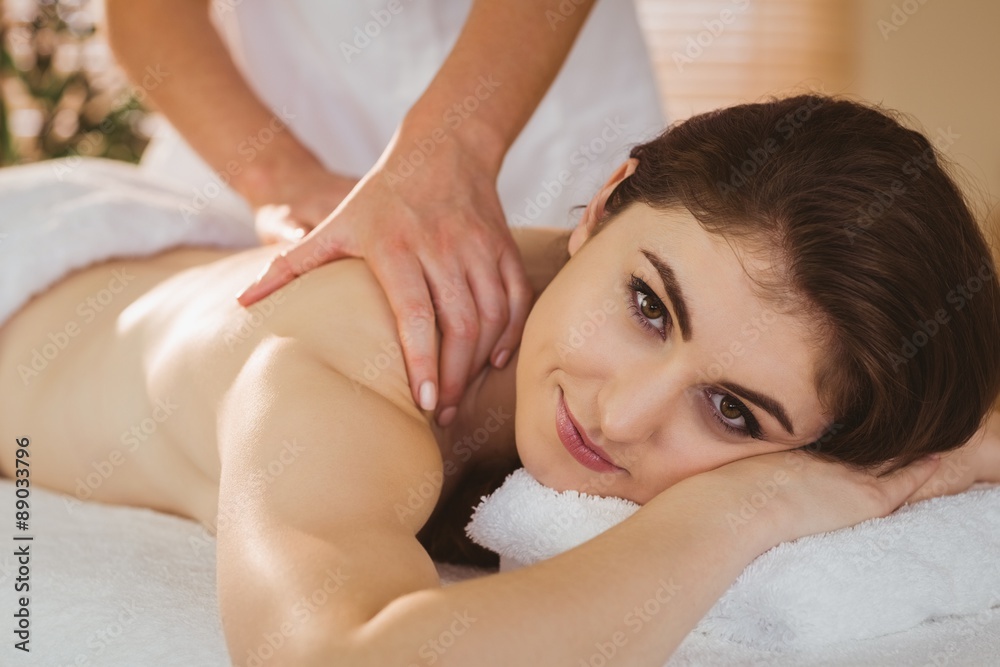 Young woman getting shoulder massage