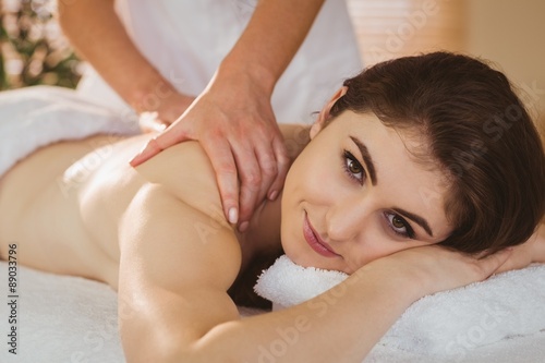 Young woman getting shoulder massage