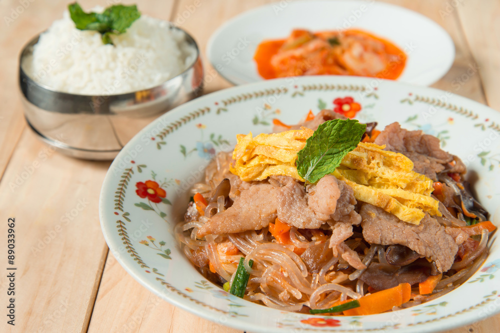 Korean traditional food. Stir fried glass noodle with soy sauce Stock