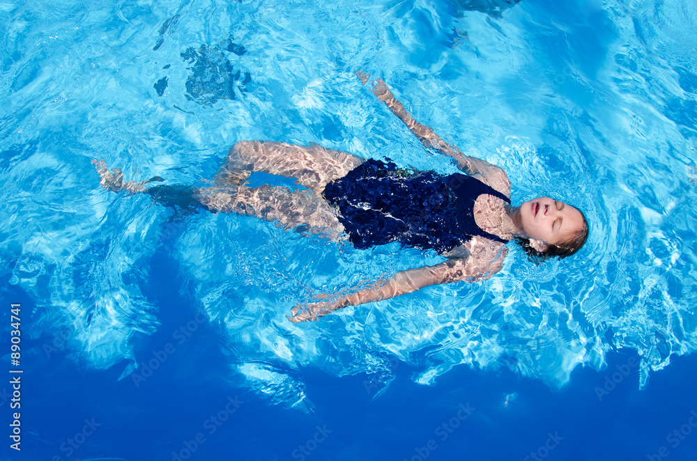 girl teenager lying on the water