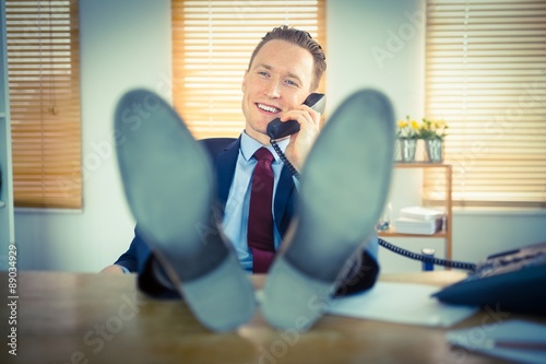 Relaxed businessman making a phone call
