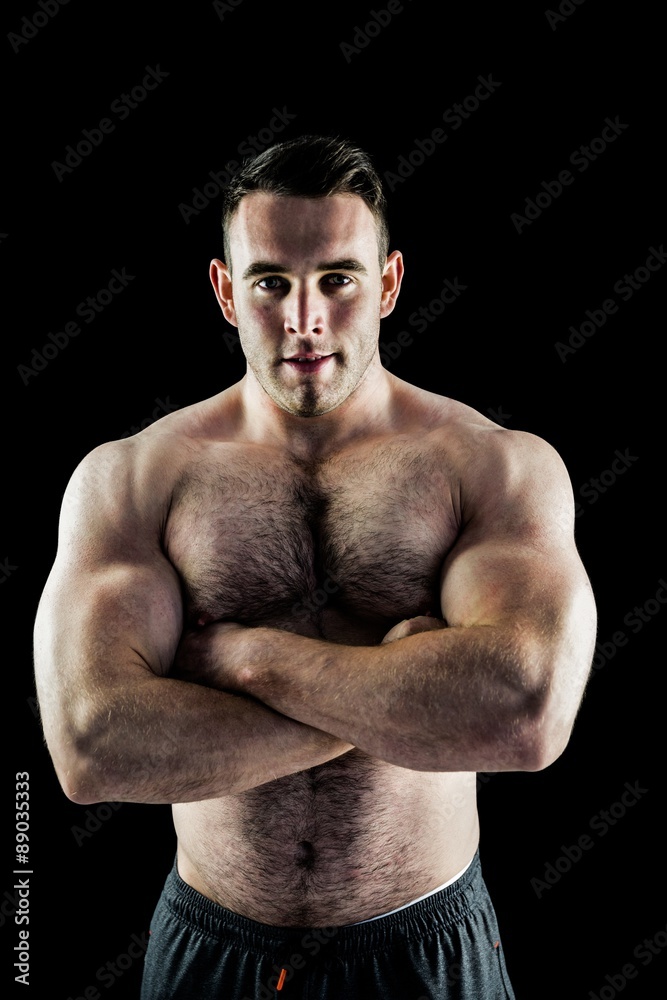 Handsome bodybuilder with arms crossed