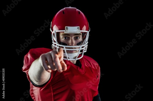 Portrait of american football player pointing to camera