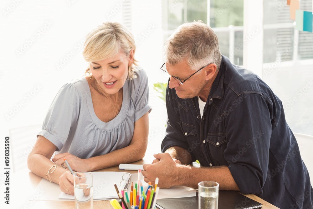 Smiling business team working together Smiling business team working together