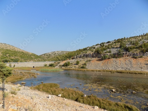 Sea, hills and blue sky