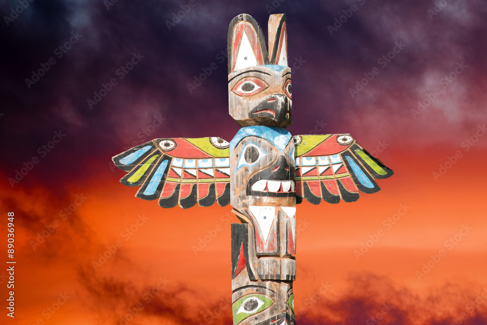 Totem wood pole in the gold cloudy background Stock Photo | Adobe Stock