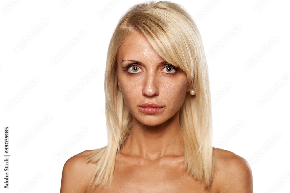 young woman without makeup posing in the studio young woman without makeup posing in the studio