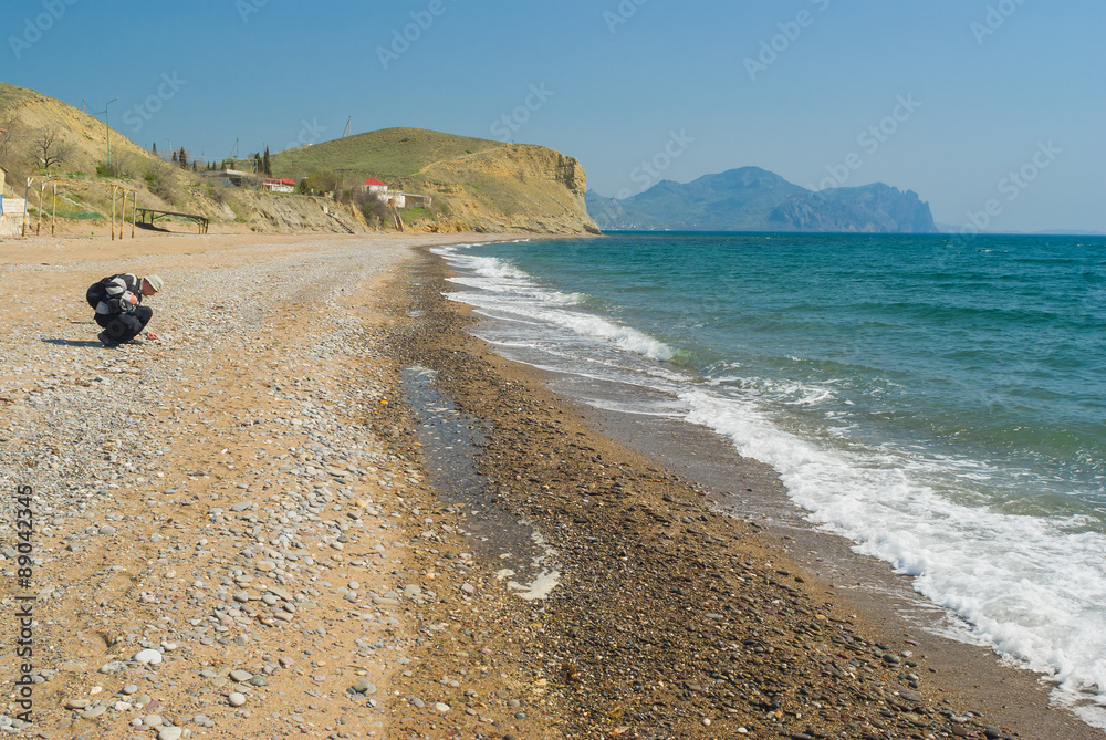 Wild pebbly beach on a Black Sea shore on Meganom cape - Crimean peninsula
