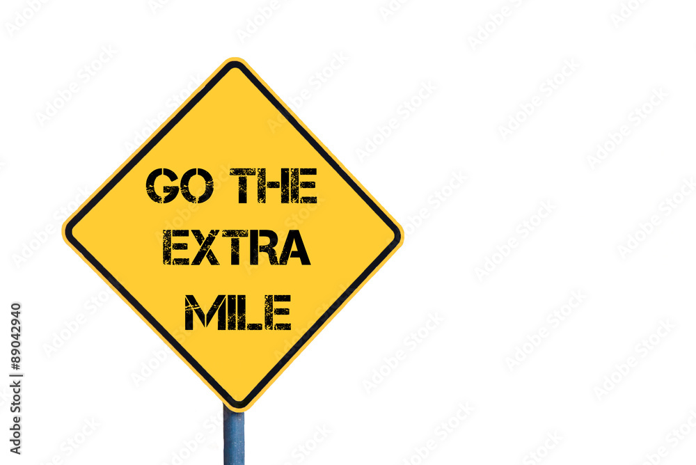 Yellow roadsign with Go The Extra Mile message