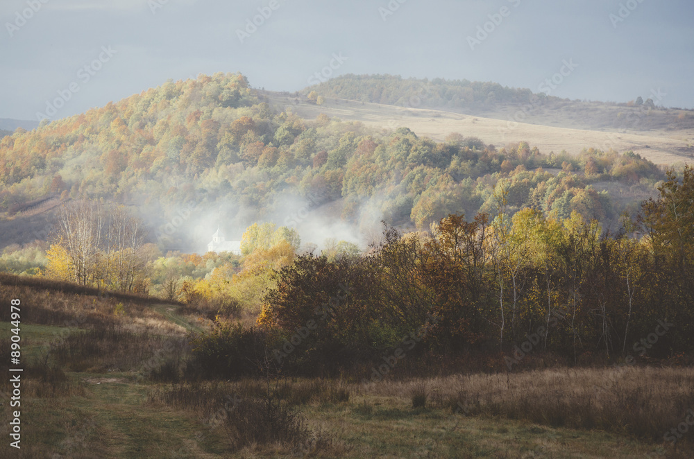 autumn landscape with village in the distance autumn landscape with village in the distance