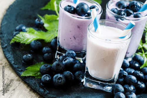 Milkshake with wild blueberries and blackberries with striped st