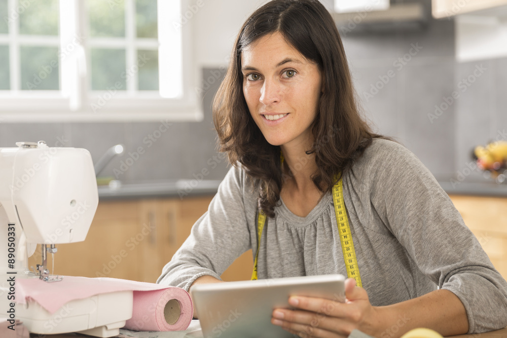 young seamstress with a tablet young seamstress with a tablet
