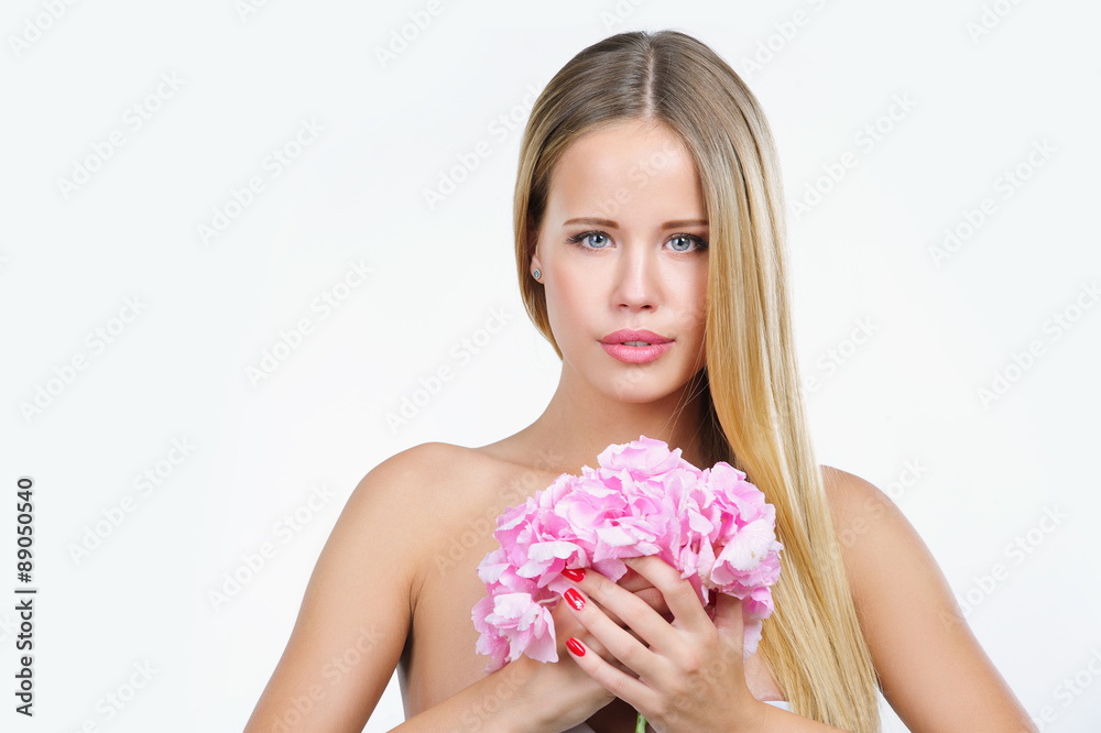 Natural beauty portrait of attractive woman with beautiful fresh skin holding pink flower, isolated on white background