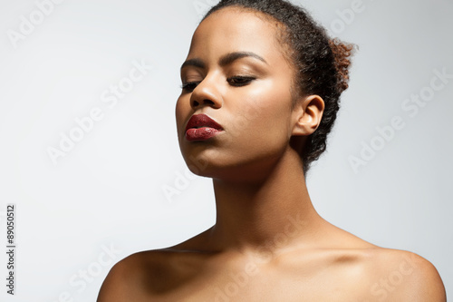 Portrait of a beautiful black woman in profile with his eyes closed