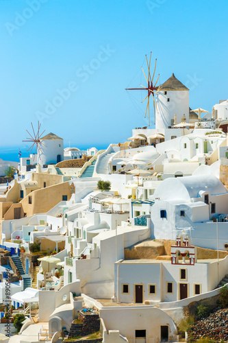 Windmills and apartments in Oia town, Santorini