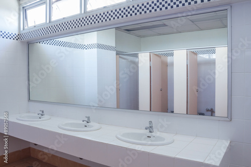 Bathroom at office.Handbasin and mirror in toilet