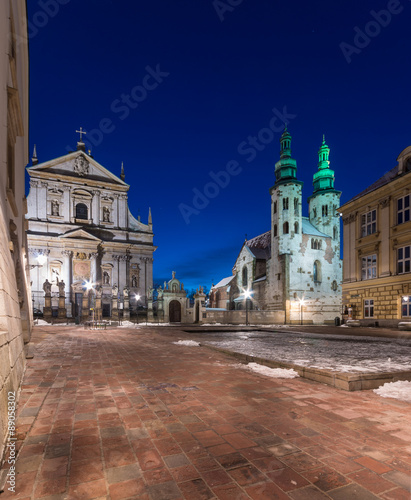Krakow, Poland, night view of Saint Mary Magdalene square with catholic churches of Saints Peter and Paul and Saint Andrew #89058302