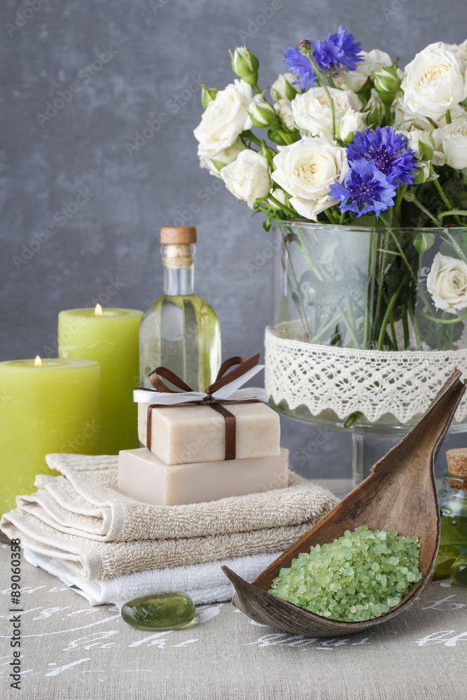 Bowl od green sea salt, bars of handmade soap, essential oil and Bowl od green sea salt, bars of handmade soap, essential oil and