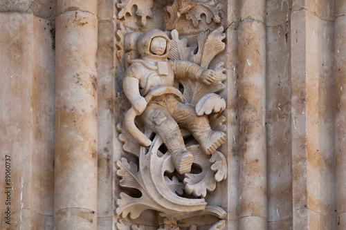 The famous astronaut carved in stone in the Salamanca Cathedral Facade. The sculpture was added during renovations in 1992. photo