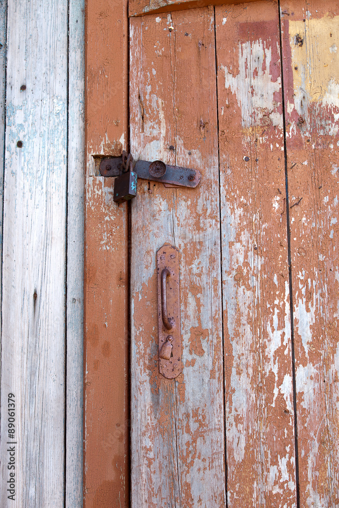 Old doors are closed on the lock Old doors are closed on the lock