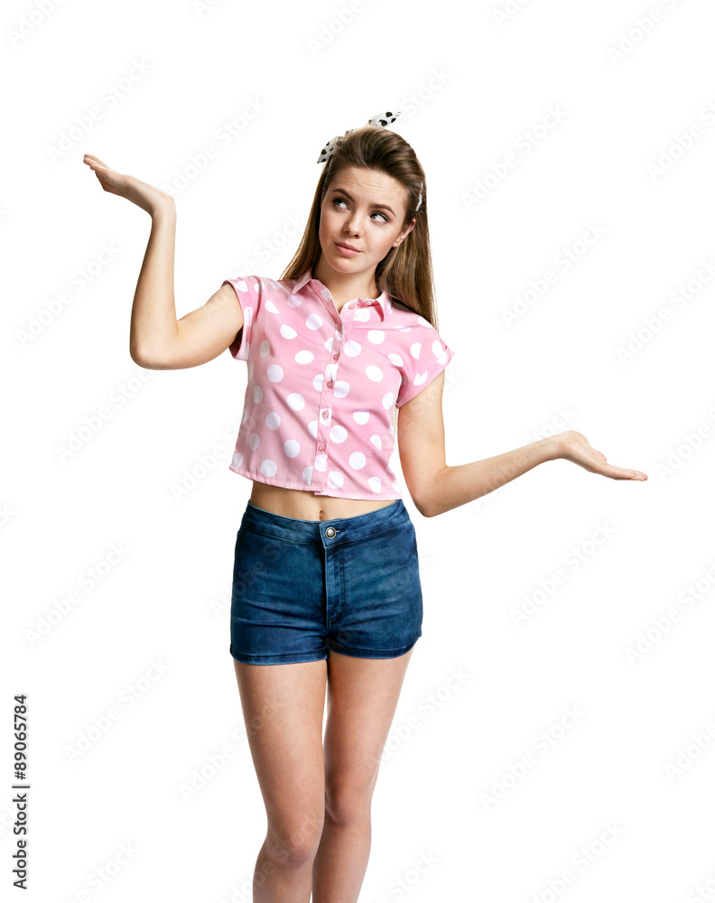 Young woman spread hands and doesn't know what to do Young woman spread hands and doesn't know what to do