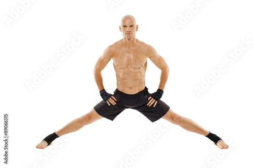 Kickboxer executing a split