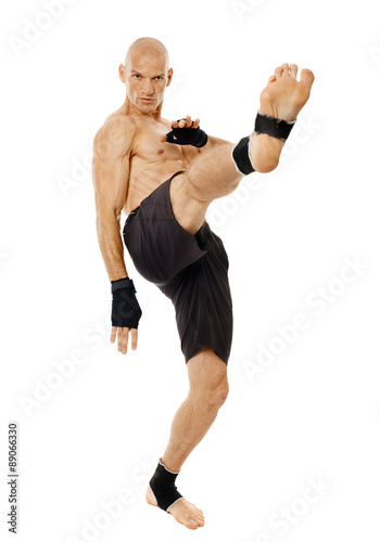 Kickboxer executing a powerful kick