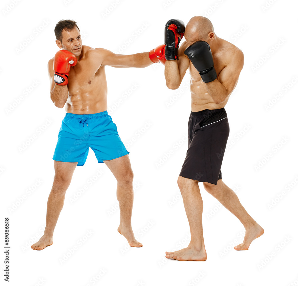 Kickboxers sparring on white