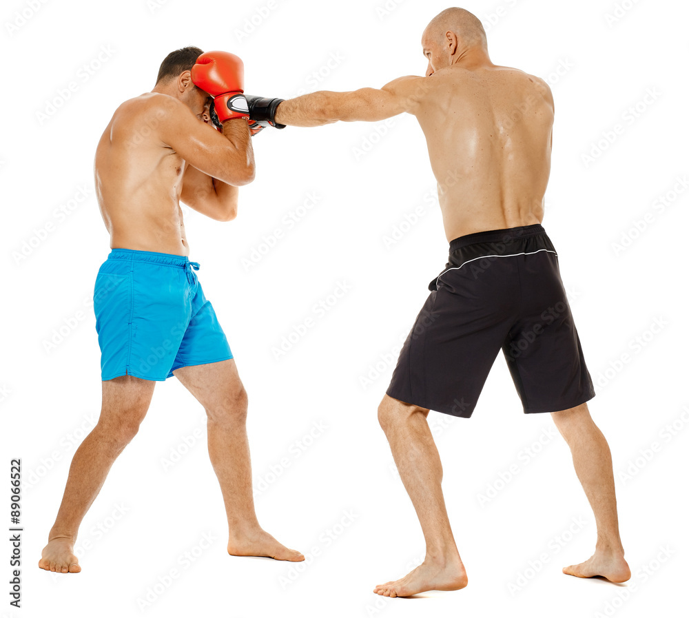 Kickboxers sparring on white