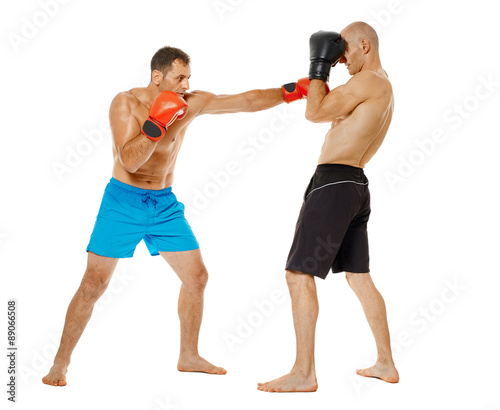 Kickboxers sparring on white © Xalanx